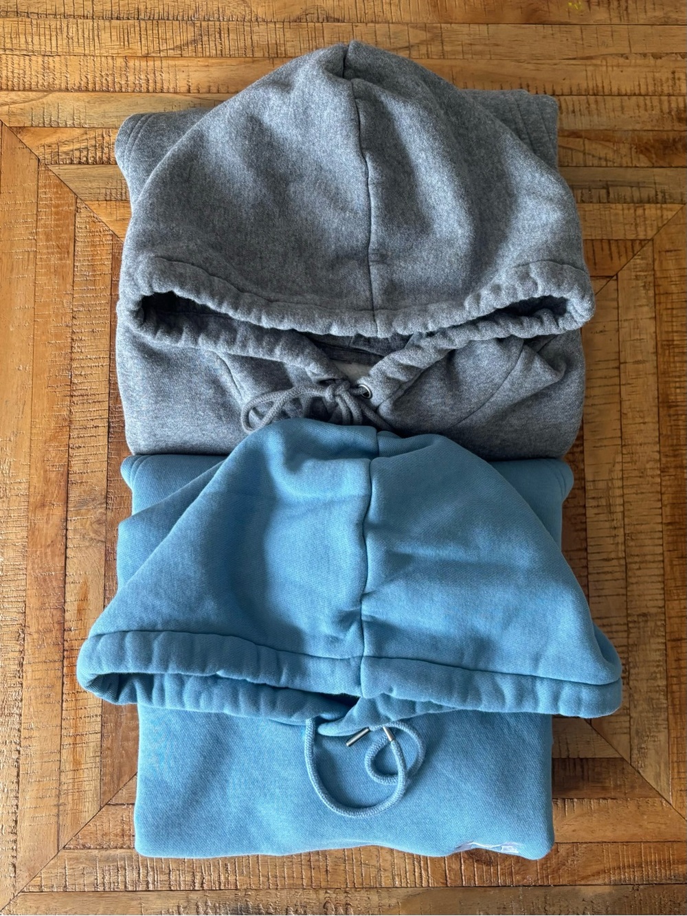 Two Under Armour Men's Medium Hooded Sweatshirts in Gray and Blue